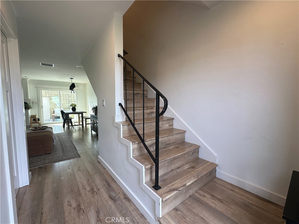 12100 Montecito Road Los Alamitos, CA 90720 - Photo 10 of 25 a view of entryway and hall with wooden floor