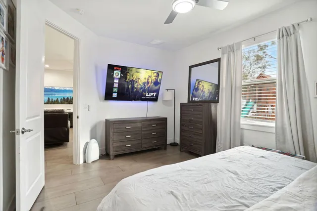 a bedroom with a bed and a television
