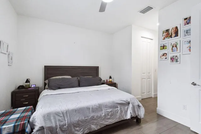 a bedroom with a bed and walk in closet