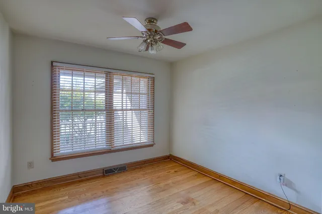 a kitchen with stainless steel appliances granite countertop a refrigerator a oven and a sink