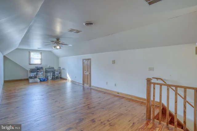 a bathroom with a sink toilet and a mirror
