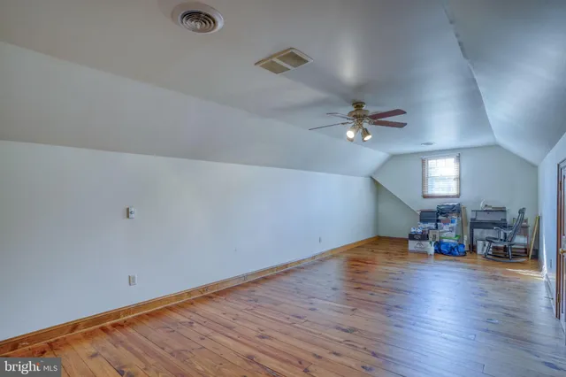 a view of an empty room with a fireplace