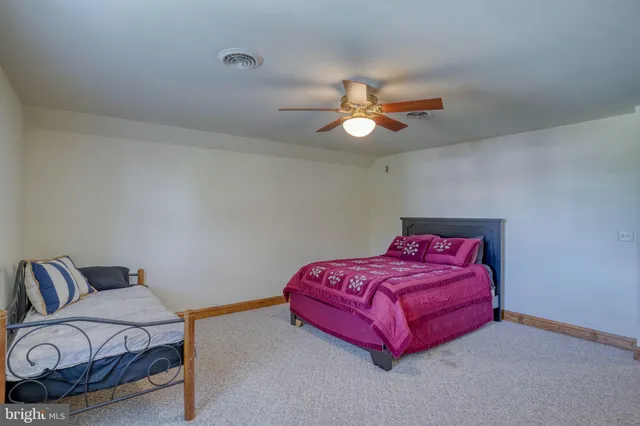 a view of an empty room with a fireplace