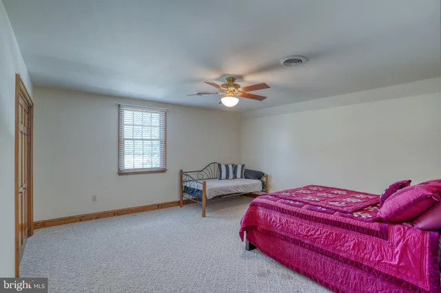 an empty room with wooden floor