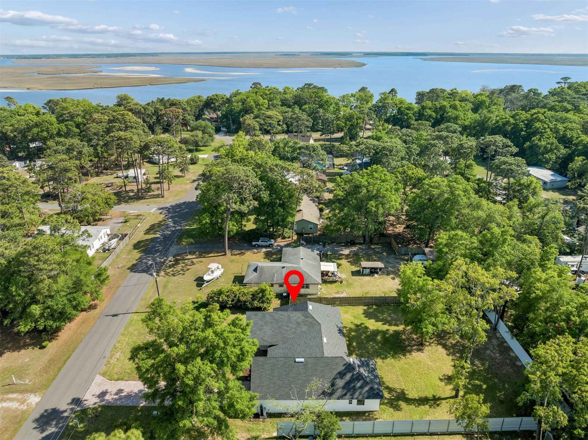 95121 North Ellis Landing Road Fernandina Beach, FL 32034 - Photo 2 of 37 a view of outdoor space with lots of trees in the background