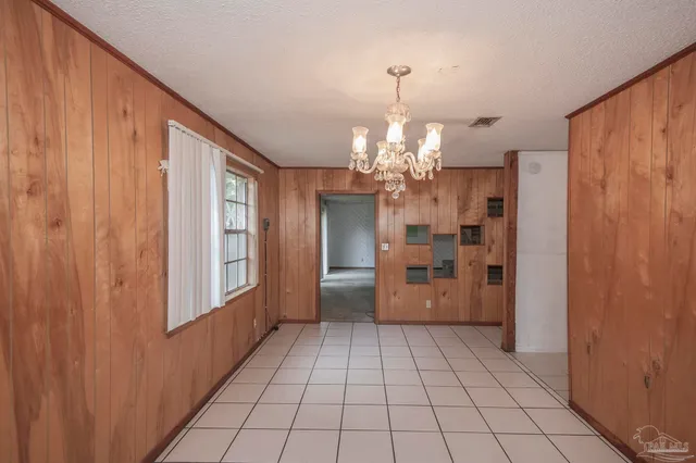 a view of a hallway with a chandelier
