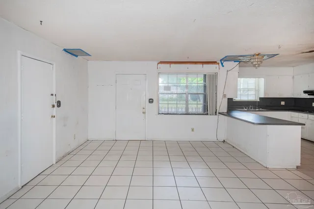 a view of an empty room and window