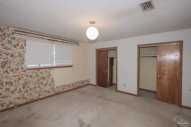 an empty room with a empty space and a window