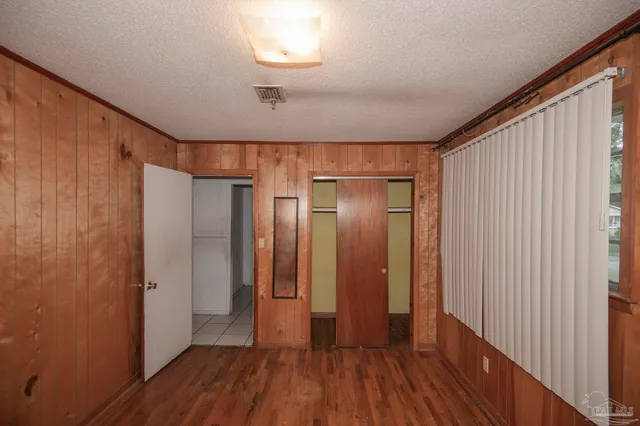 a view of hallway with wooden floor
