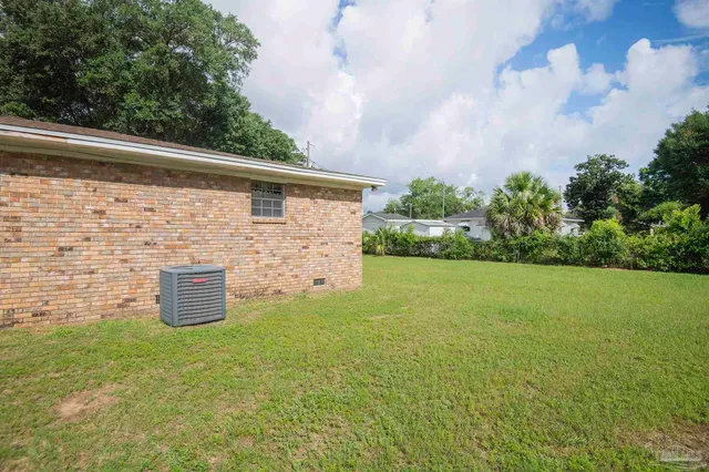 a backyard of a house with lots of green space