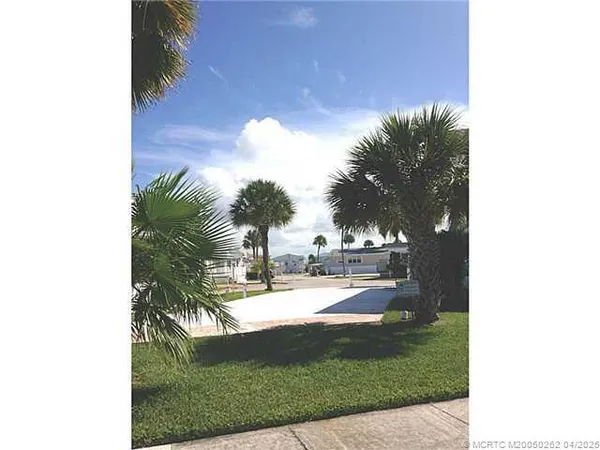 a view of a swimming pool with a yard