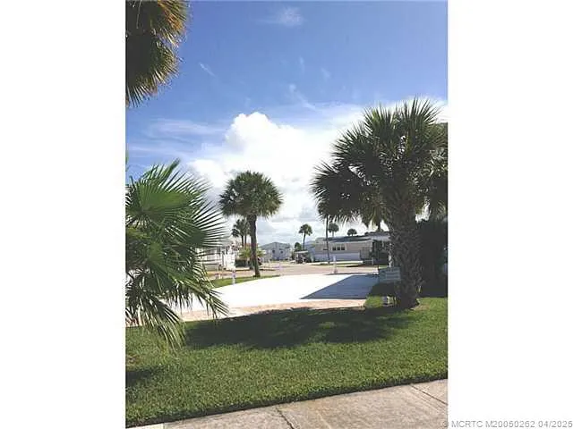 a view of a swimming pool with a yard