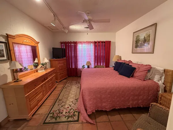 a bed room with a bed and a television