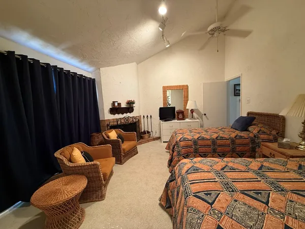 a bedroom with furniture and balcony