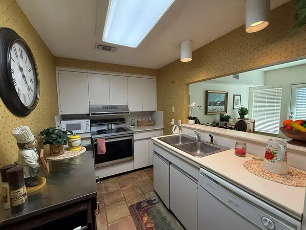 a kitchen with a stove and a sink