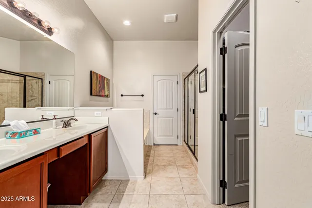a bathroom with a double vanity sink a and mirror