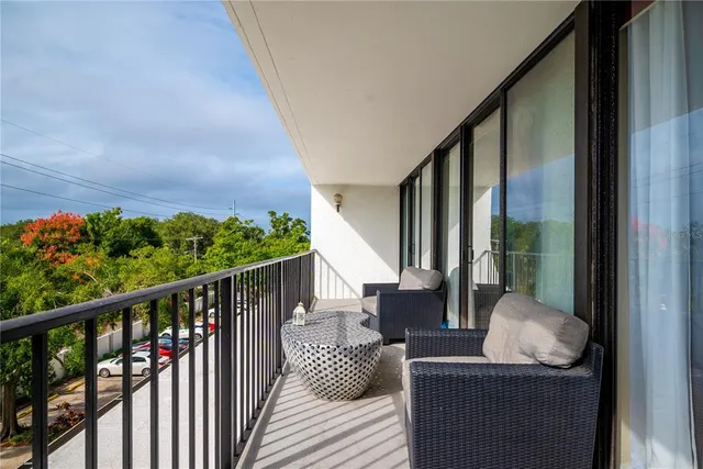 a balcony with chairs