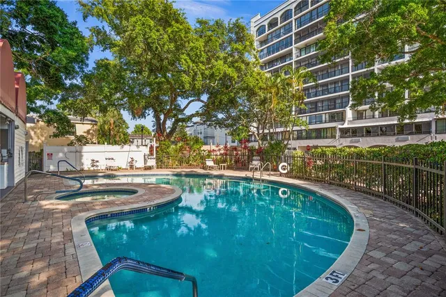 a view of swimming pool from a balcony