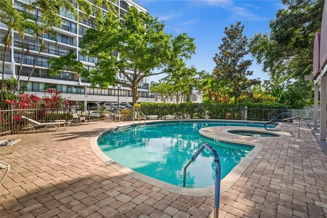 a view of a swimming pool with a patio