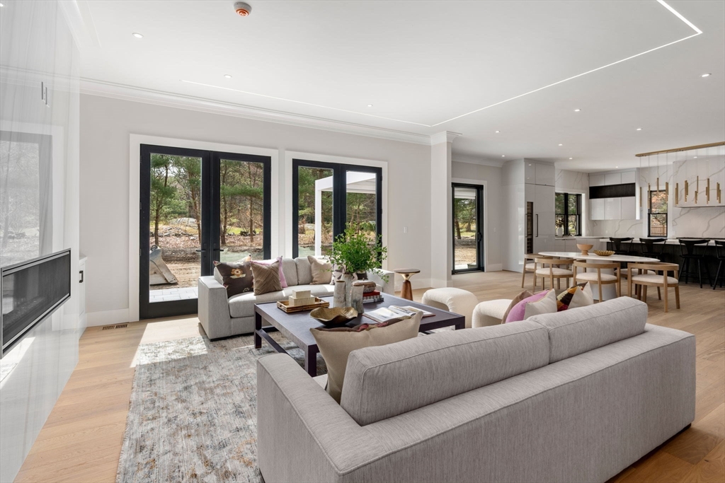 211 Stratford Road Needham, MA 02492 - Photo 11 of 32 a living room with furniture and a large window