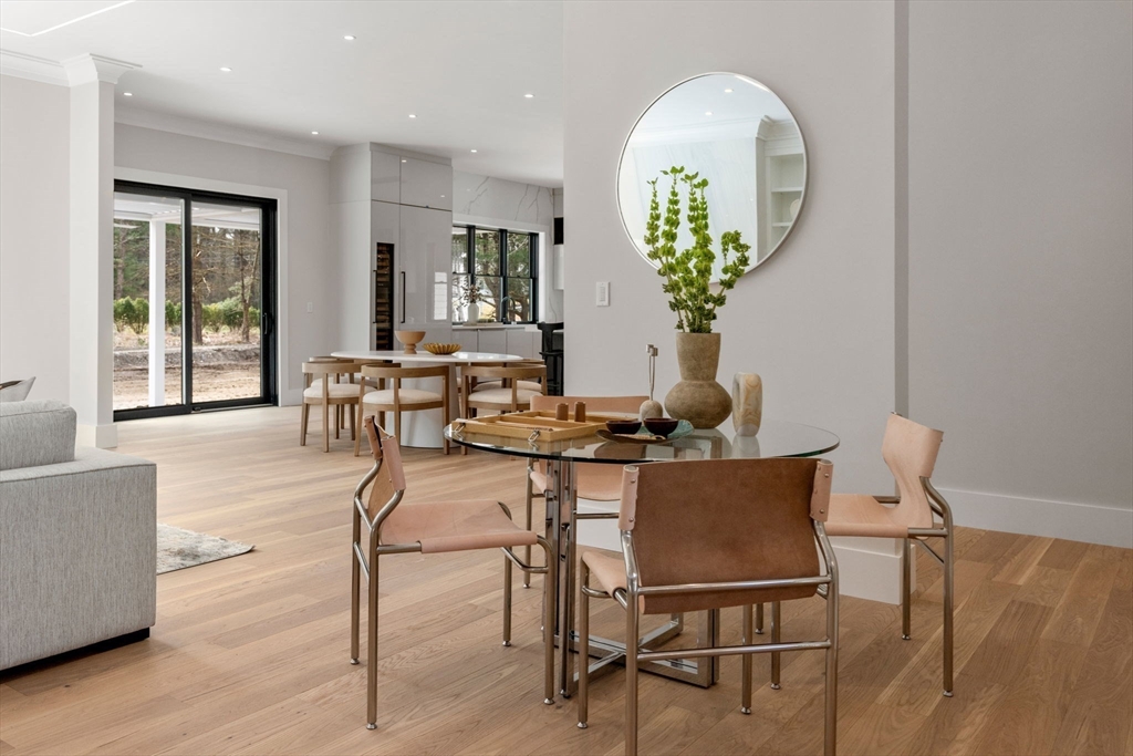 211 Stratford Road Needham, MA 02492 - Photo 14 of 32 a view of a dining room with furniture and a potted plant