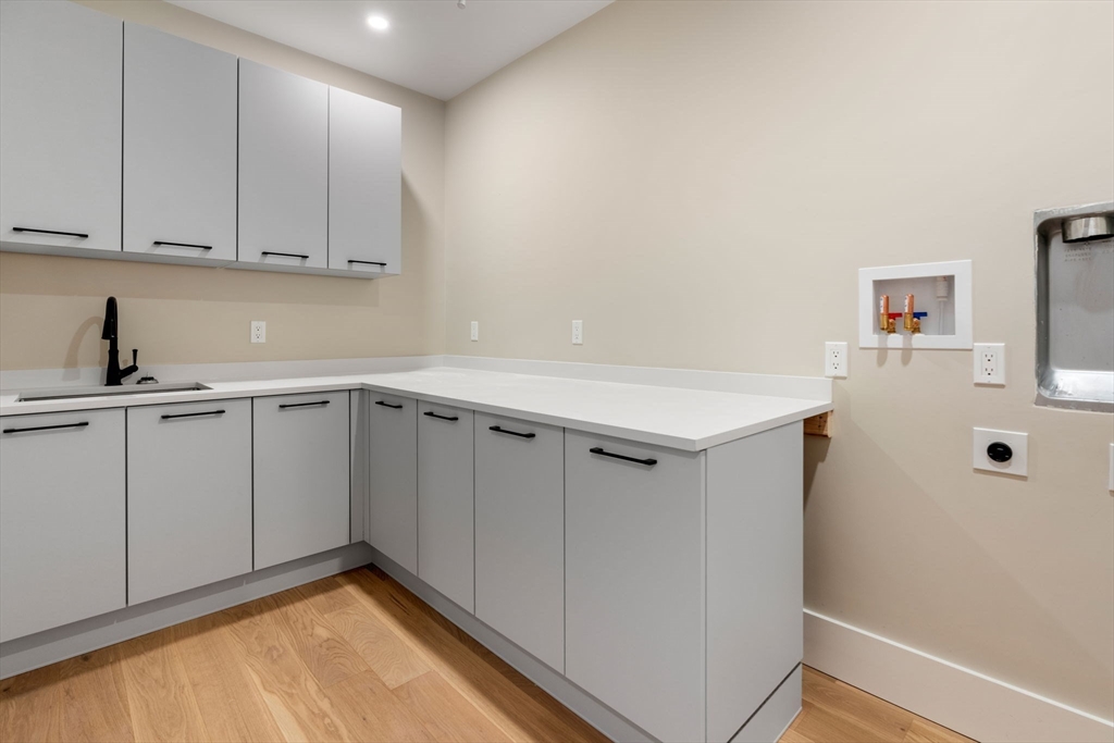 211 Stratford Road Needham, MA 02492 - Photo 25 of 32 a view of a kitchen with white cabinets