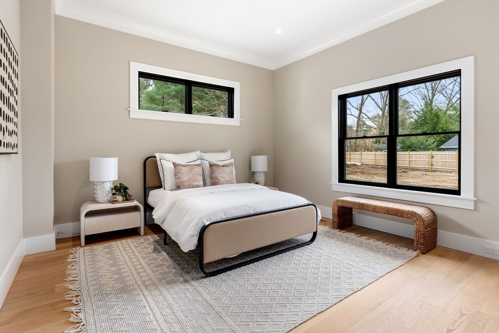 211 Stratford Road Needham, MA 02492 - Photo 26 of 32 a bedroom with a bed and a large window