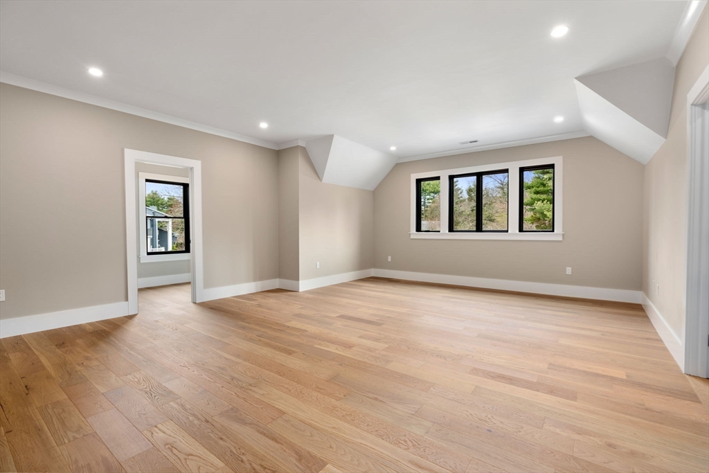 211 Stratford Road Needham, MA 02492 - Photo 27 of 32 an empty room with wooden floor and windows