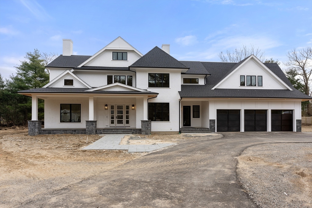 211 Stratford Road Needham, MA 02492 - Photo 31 of 32 front view of a house with a garden