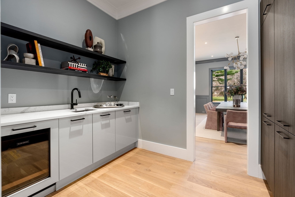 211 Stratford Road Needham, MA 02492 - Photo 6 of 32 a kitchen with stainless steel appliances granite countertop a sink and cabinets