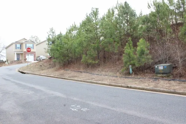 a stone house with a yard