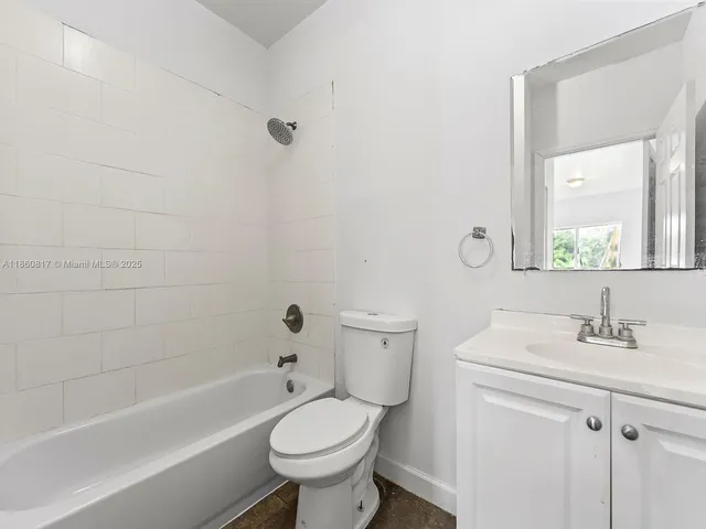 a bathroom with a sink toilet and bathtub