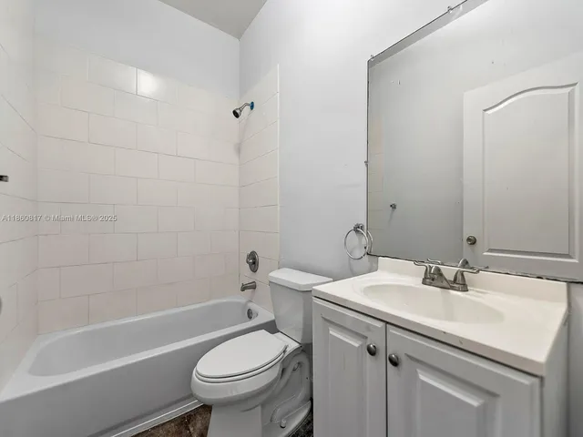 a bathroom with a sink a toilet and a bathtub