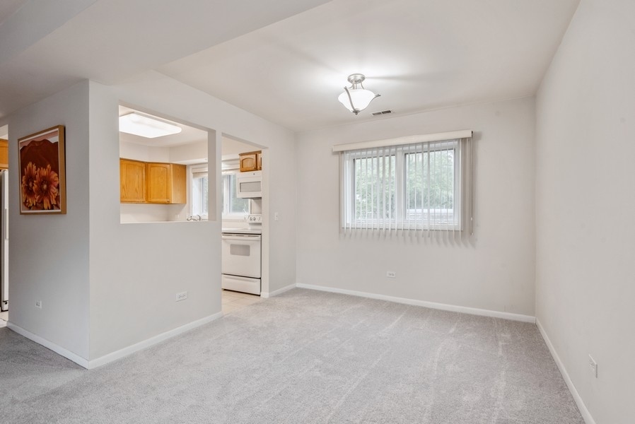 435 Ridge Road, Unit 305 Wilmette, IL 60091 - Photo 5 of 10 a view of livingroom with window