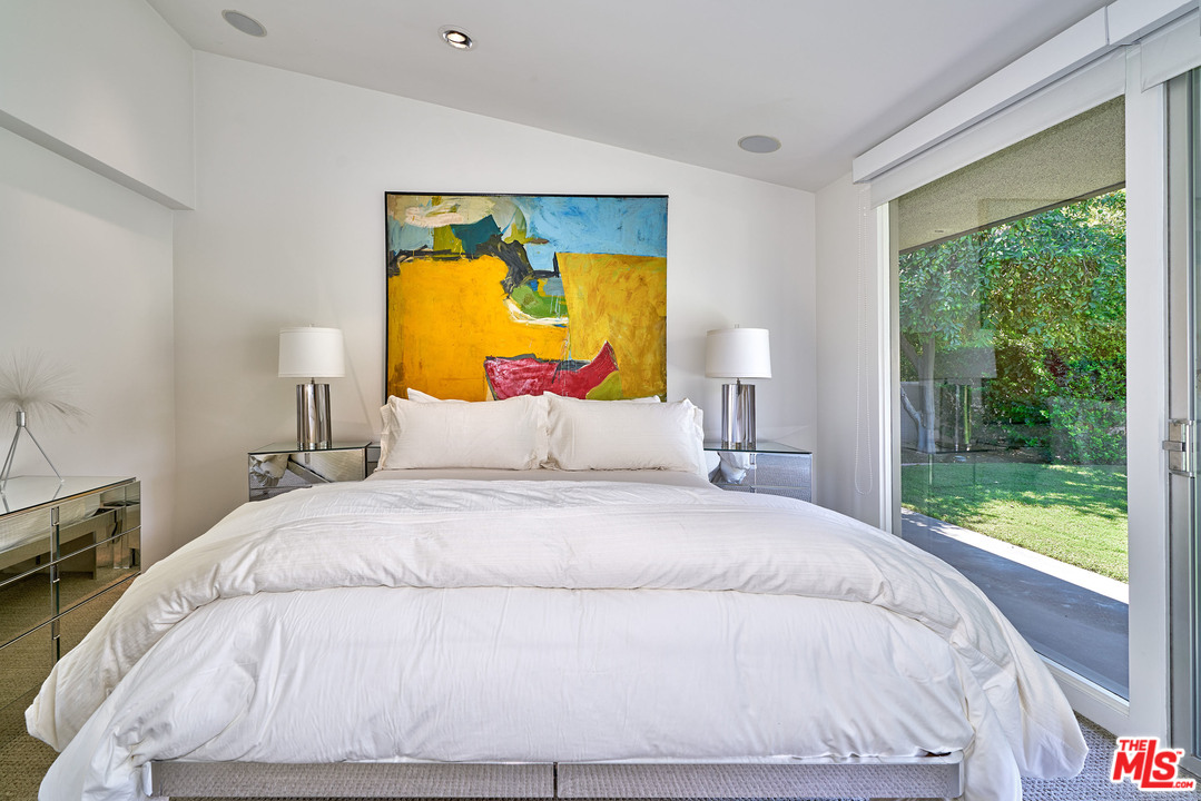 70411 Pecos Road Rancho Mirage, CA 92270 - Photo 15 of 40 a large white bed in a bedroom next to a window