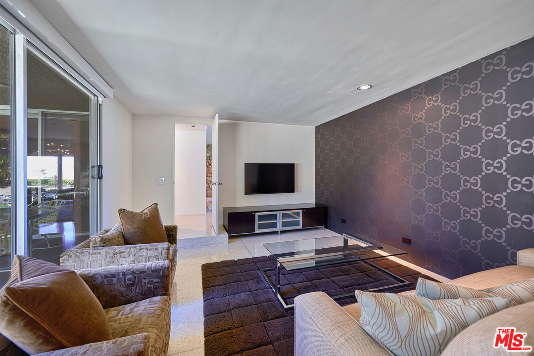 70411 Pecos Road Rancho Mirage, CA 92270 - Photo 20 of 40 a living room with furniture and a flat screen tv