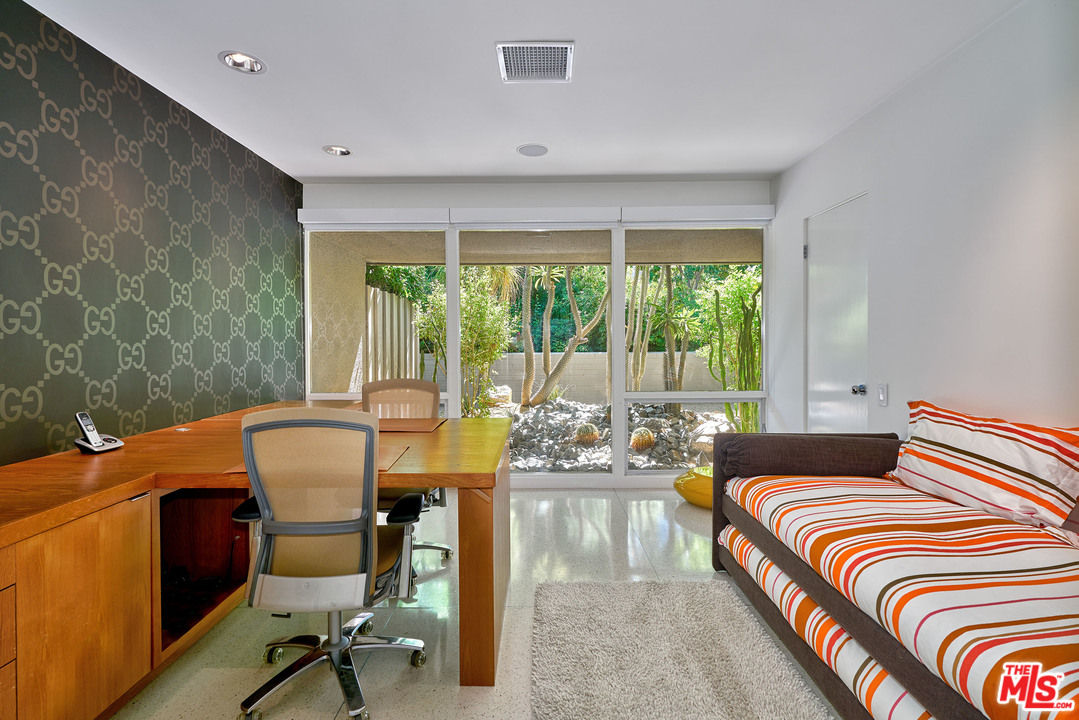 70411 Pecos Road Rancho Mirage, CA 92270 - Photo 21 of 40 a bedroom with a bed and a desk