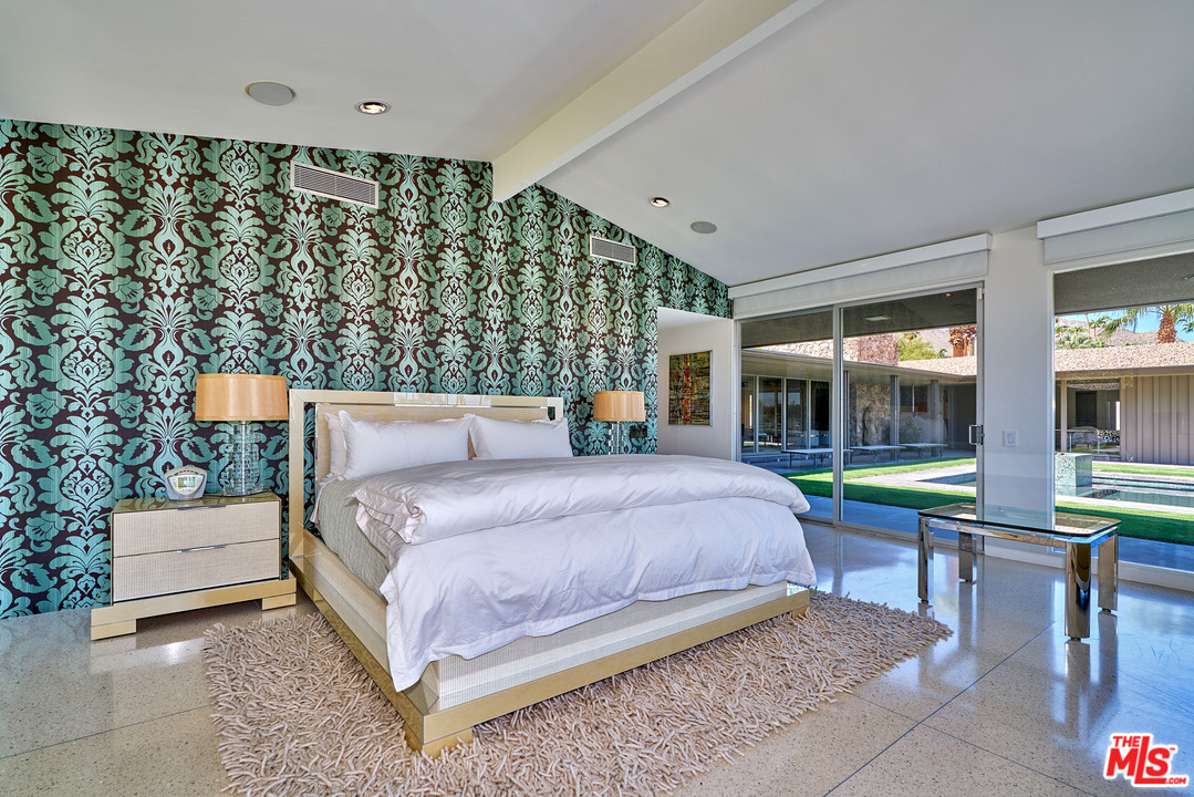 70411 Pecos Road Rancho Mirage, CA 92270 - Photo 23 of 40 a bedroom with a bed and large window