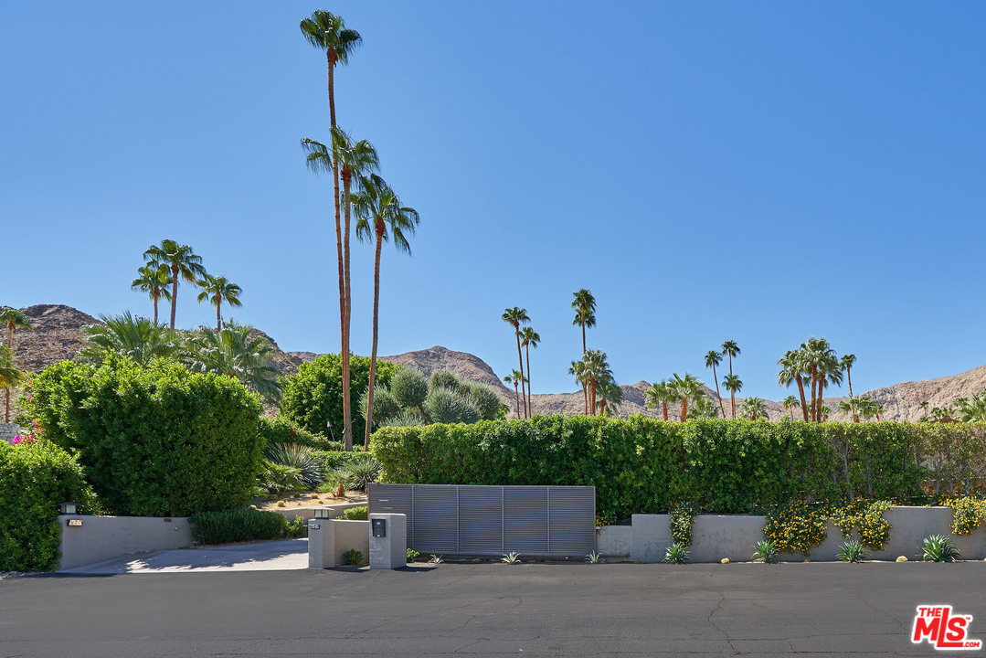 70411 Pecos Road Rancho Mirage, CA 92270 - Photo 28 of 40 a front view of a house with a yard and garage