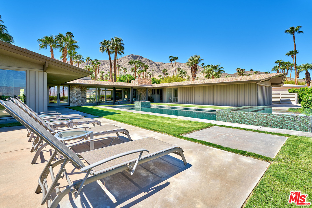 70411 Pecos Road Rancho Mirage, CA 92270 - Photo 31 of 40 a view of a house with pool and chairs