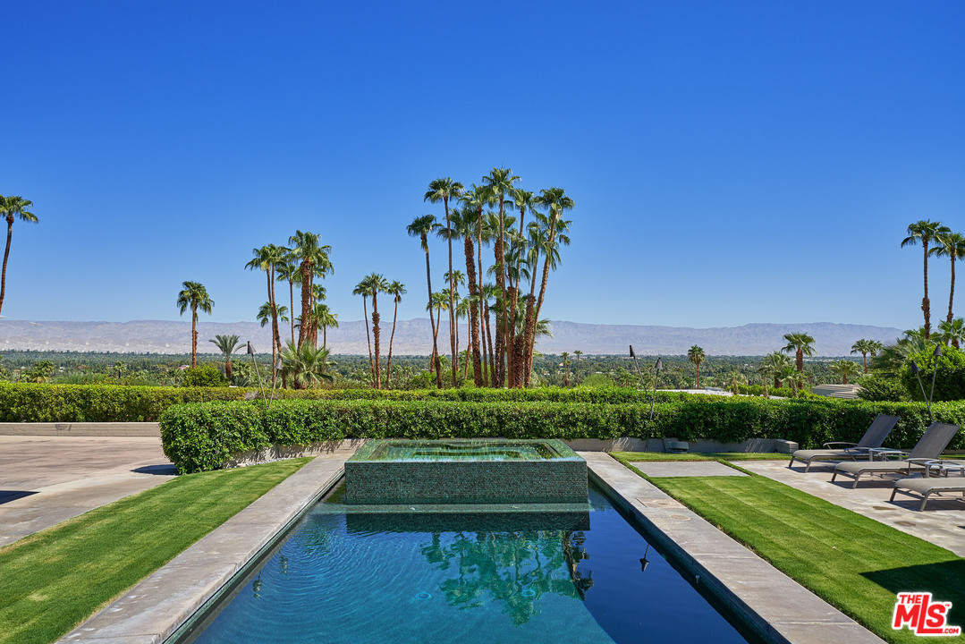 70411 Pecos Road Rancho Mirage, CA 92270 - Photo 35 of 40 a view of swimming pool with a garden