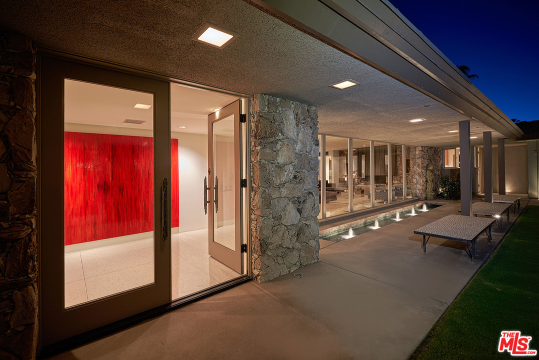70411 Pecos Road Rancho Mirage, CA 92270 - Photo 36 of 40 a lobby with furniture and a floor to ceiling window