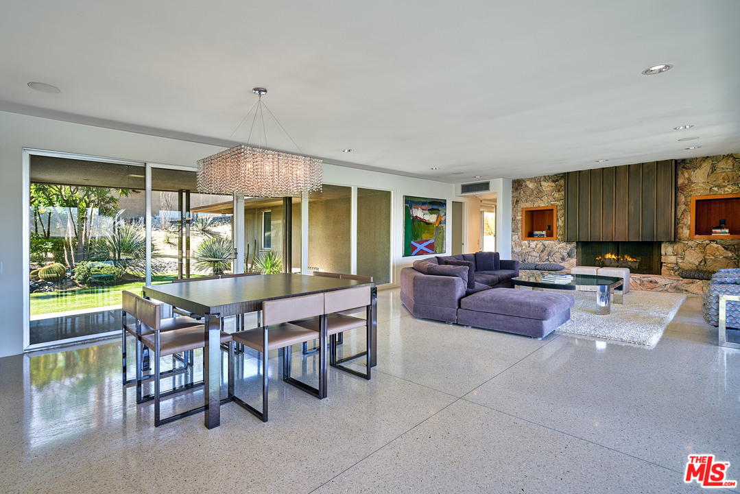 70411 Pecos Road Rancho Mirage, CA 92270 - Photo 10 of 40 a living room with furniture a large window and dining table