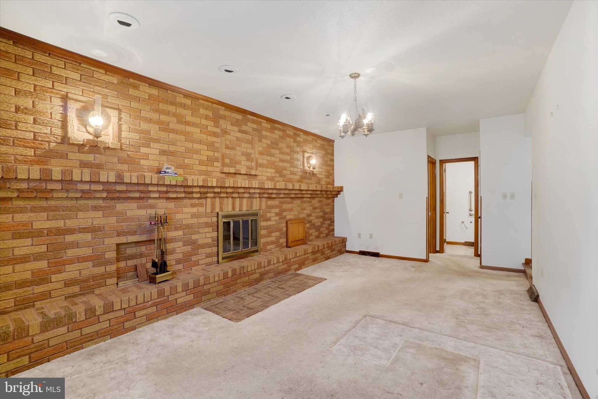 2236 Bob White Lane Lancaster, PA 17601 - Photo 5 of 42 Sunken family room with custom brick fireplace