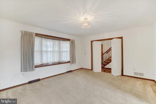 a bathroom with a granite countertop toilet sink and mirror