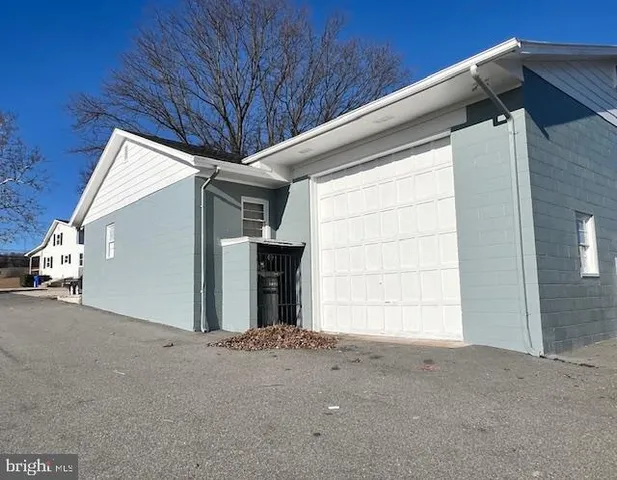 a view of a patio with swimming pool