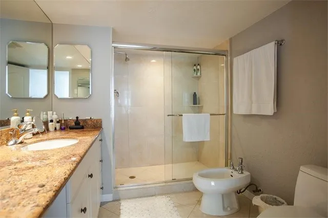 a en suite bathroom with a sink and mirror