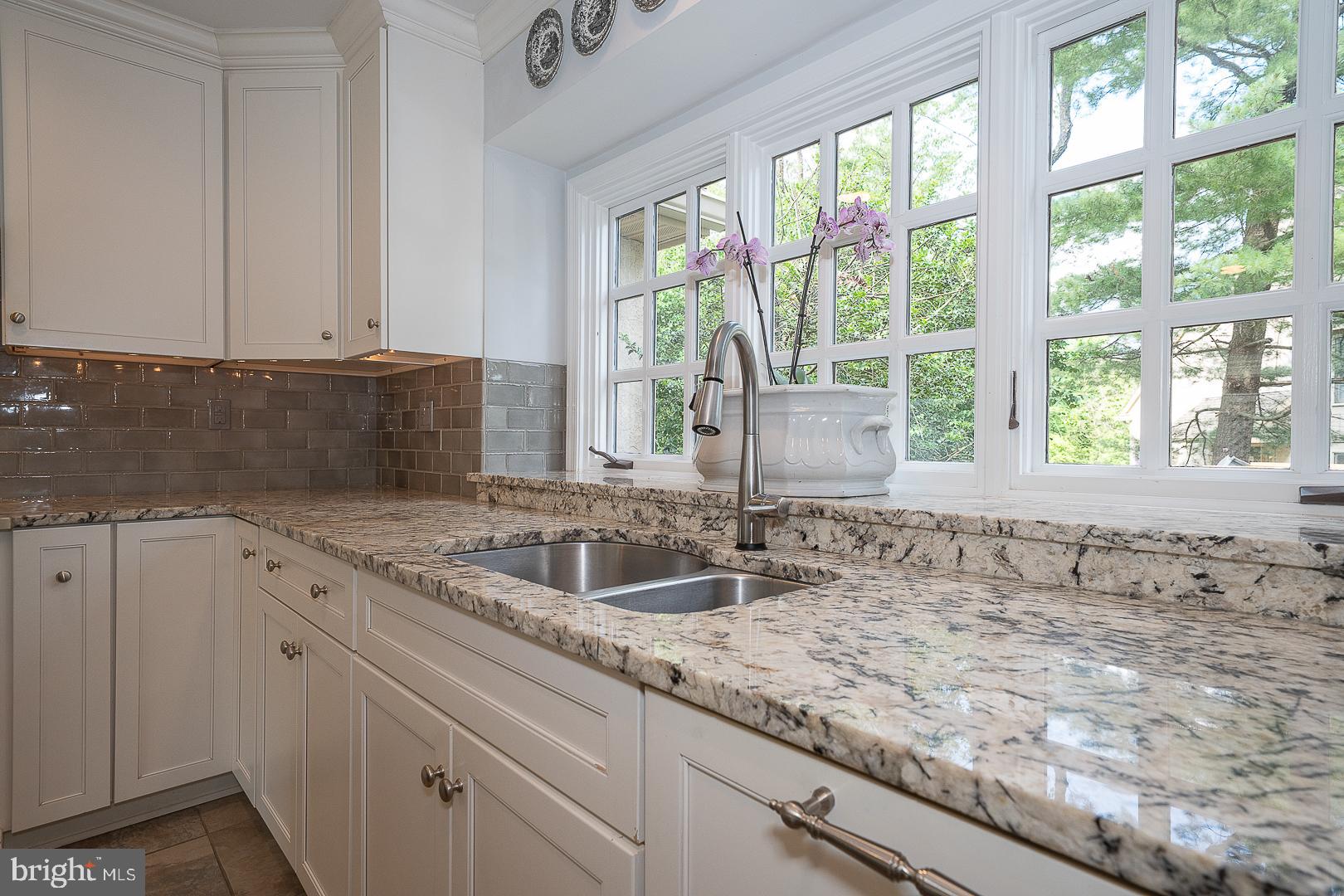431 Waynesbrooke Road Berwyn, PA 19312 - Photo 19 of 63 a bathroom with a granite countertop sink and a window