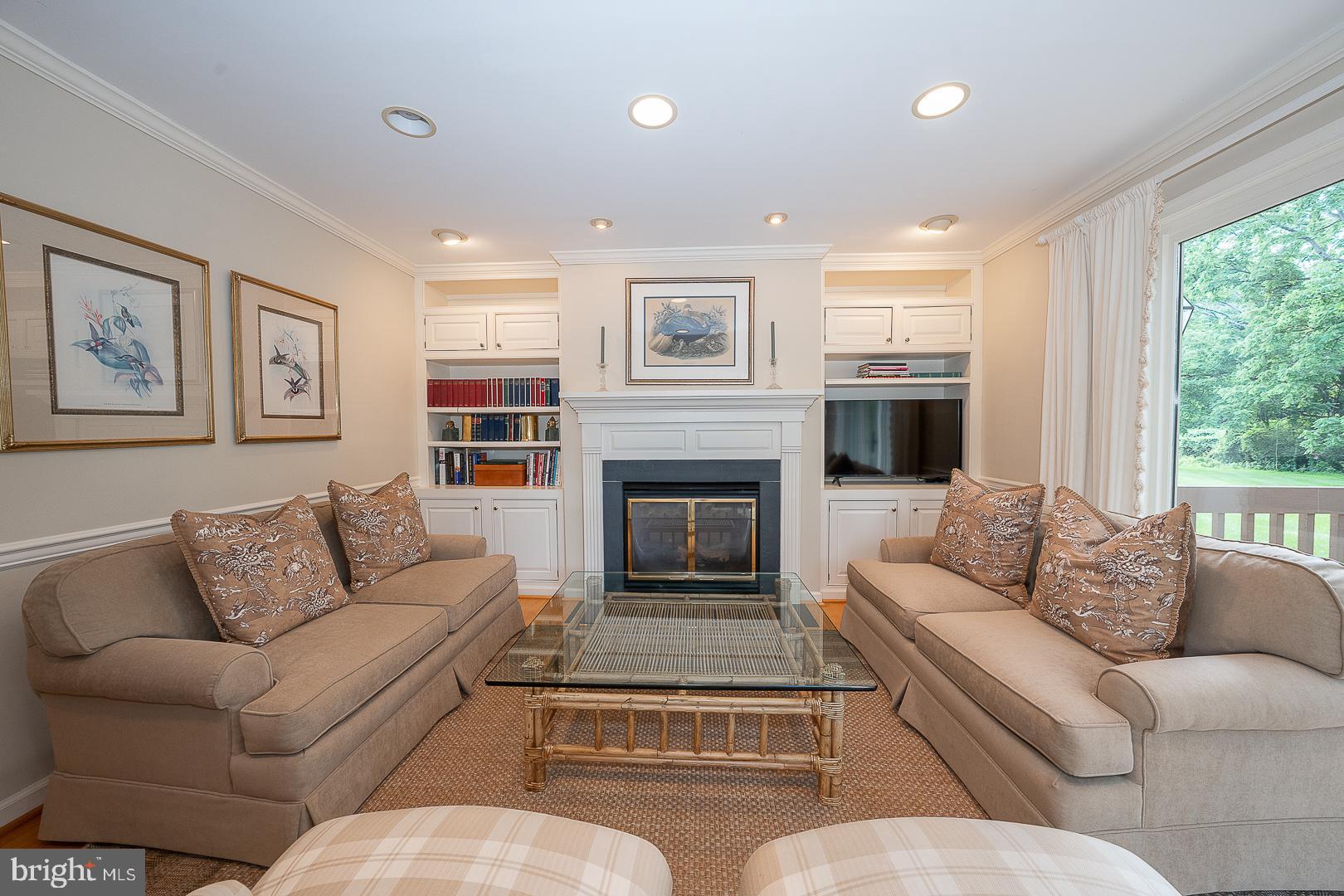 431 Waynesbrooke Road Berwyn, PA 19312 - Photo 8 of 63 a living room with furniture a large window and a fireplace