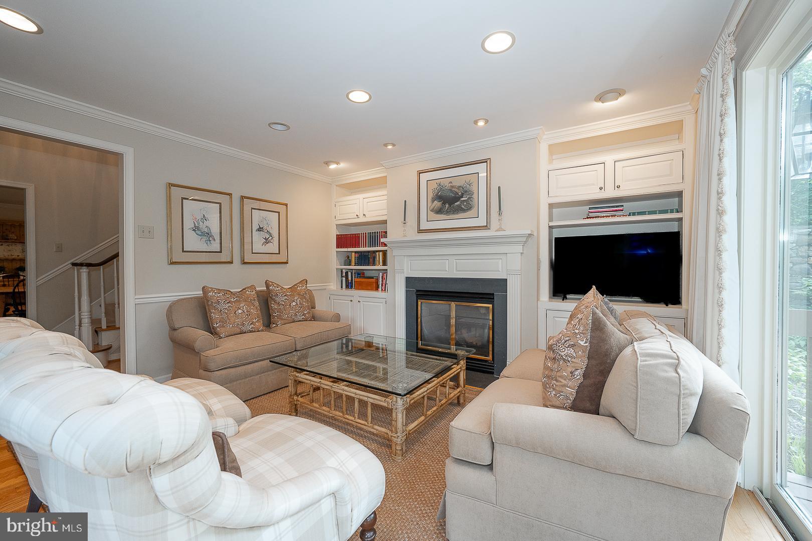 431 Waynesbrooke Road Berwyn, PA 19312 - Photo 9 of 63 a living room with furniture fireplace and a television